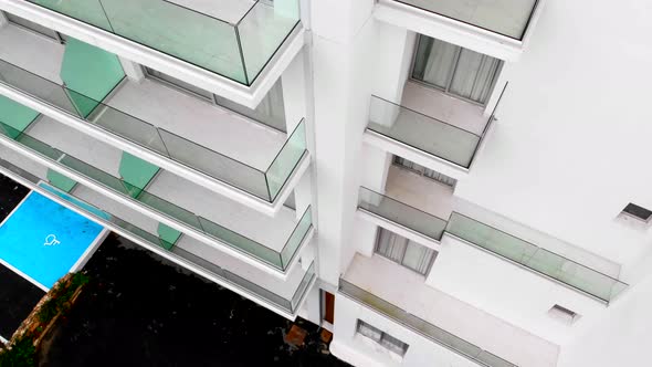 An Empty Building for Aerial Photography. Abandoned White Hotel. Top To Bottom alt