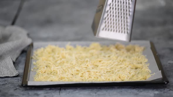 Woman's Hands Grating Pastry Dough with a Grater