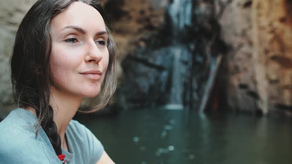 Portrait of Woman Enjoy Cascade Waterfall View