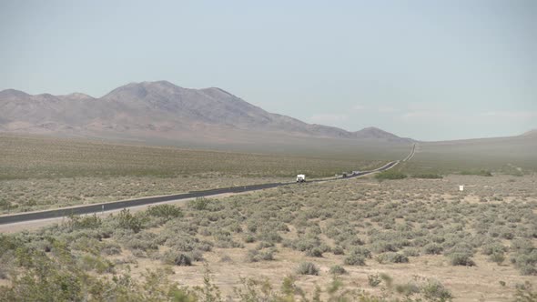 Pan right of road and vegetation in Death Valley alt