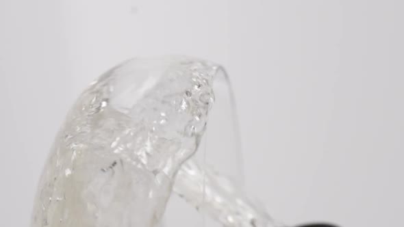 Vertical video, Close-up of sparkling champagne being poured into a glass; bubbles in a glass alt