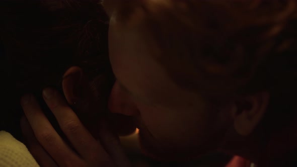 Couple Faces Kissing Lovely Together at Fireplace alt