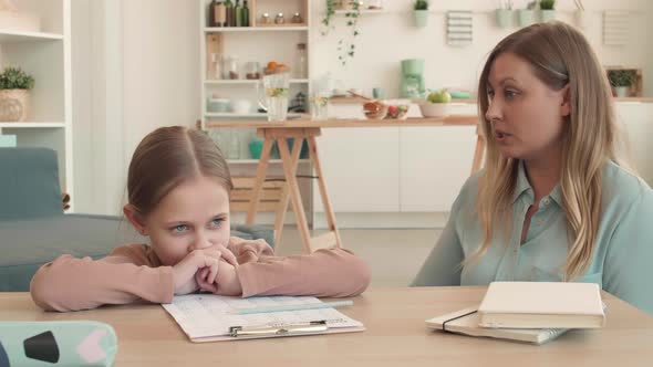 Mother Is Upset with Her Daughter Homework alt