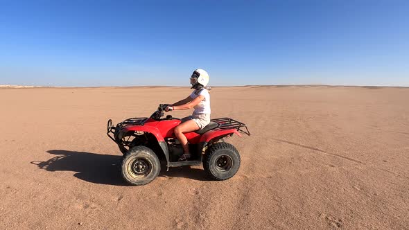A Happy Family Rides Quad Bikes in the Desert
