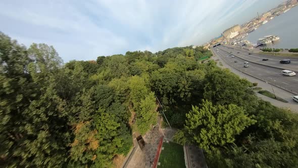FPV Drone Footage of Fly Over Park Bridge at Sunrise