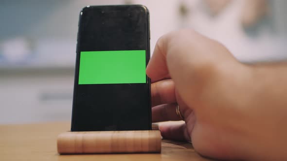 Man's Finger Double Touching Display Modern Mobile Phone alt