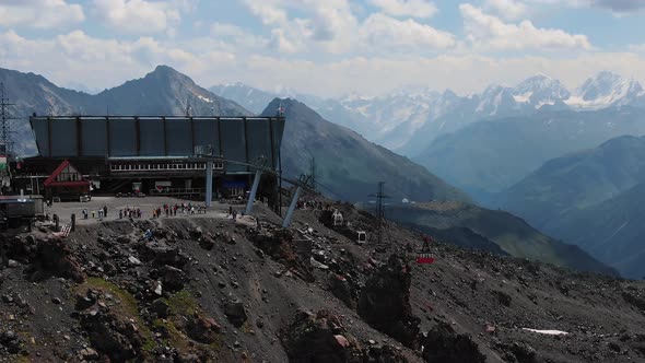 Aerial View the Old Red Elevator Cabin Rises to the Cable Car Station in the Highlands Against the alt