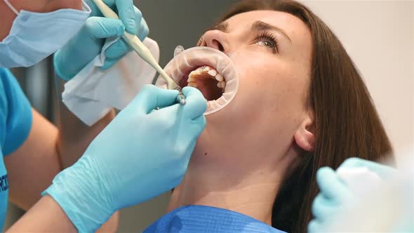 Dentist Examine Patient With Braces