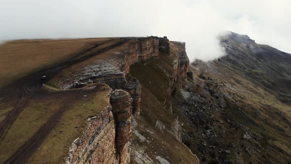 Aerial View of Stone Amphitheater in Thick Clouds Bermamyt Plateau Caucasus alt