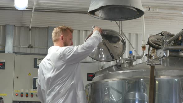 The Technologist Checks the Malt Cooking Tank for Beer Production
