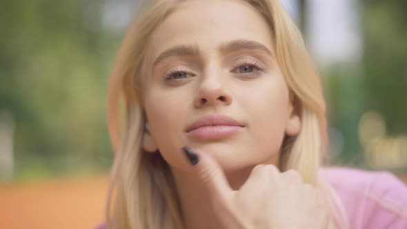 Close-up Face of Blond Young Woman with Grey Eyes Smiling at Camera. Portrait of Charming Beautiful alt