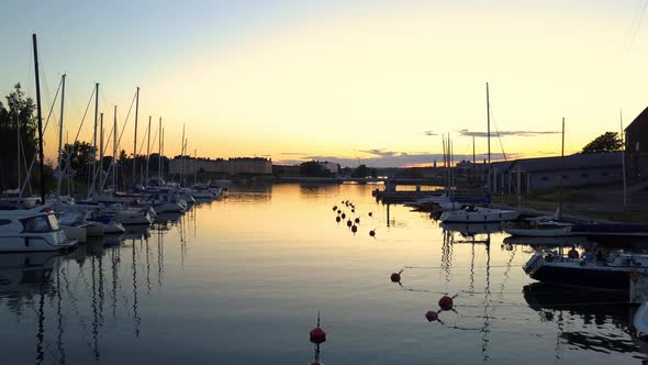 Boats moored in sea alt
