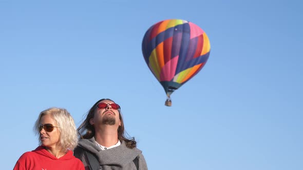 A Middleaged Man and Woman in the Sky with an Air Balloon alt