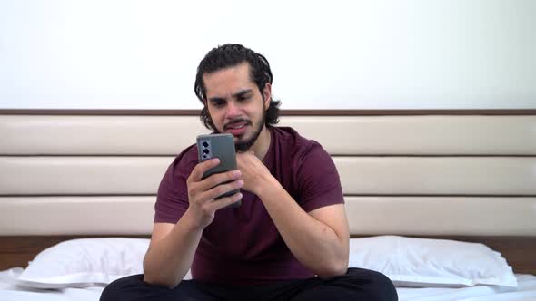 Angry Indian man chatting with someone alt