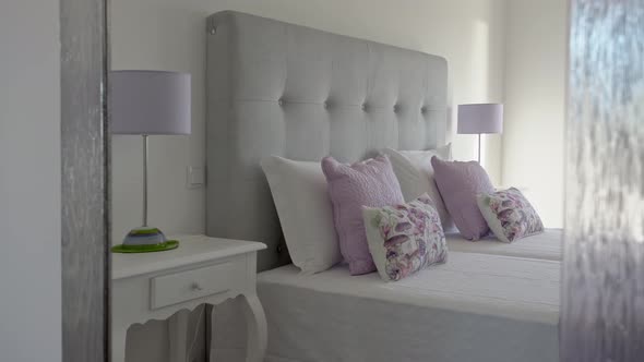 Closeup in a Bedroom Modern Bed Room with Pillows and Trendy Decorations