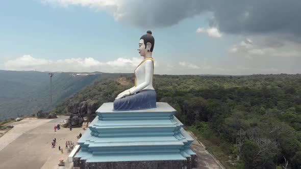 Big Statue of colourful sitting Buddha in the Bokor Mountains of Kampot, Cambodia alt