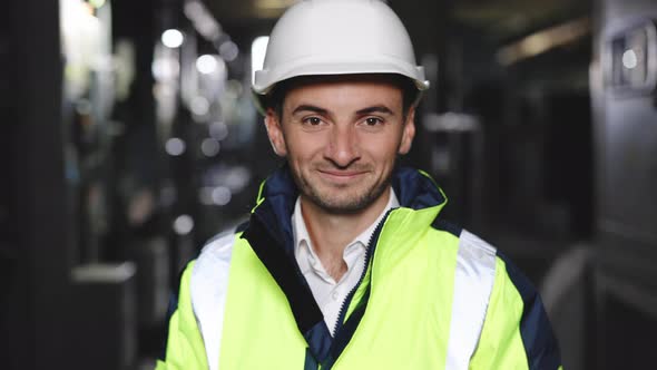 Happy Professional Heavy Industry Engineer Worker Wearing Uniform and Hard Hat in a Steel Factory