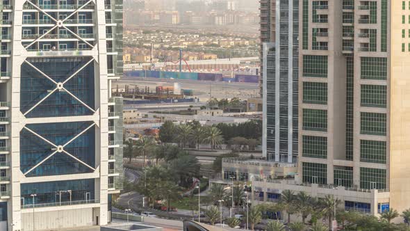Aerial View of Jumeirah Lakes Towers Skyscrapers Timelapse with Traffic on Sheikh Zayed Road alt
