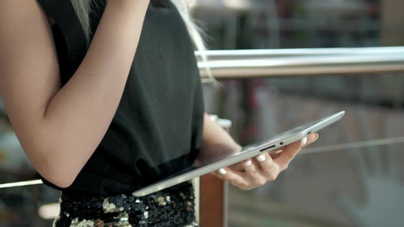 Young Female Passenger at the Airport Using Her Tablet Computer While Waiting for Flight Beautiful alt