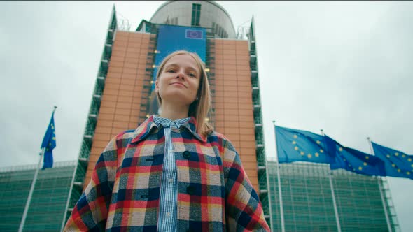 Portrait of Woman with EU Flags Near European Commission in Brussels Belgium