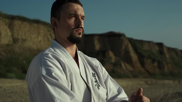 Calm Karate Man Standing Sand Close Up alt