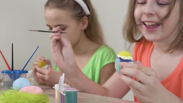 Friends Together Decorate Easter Eggs with Colors and Talk