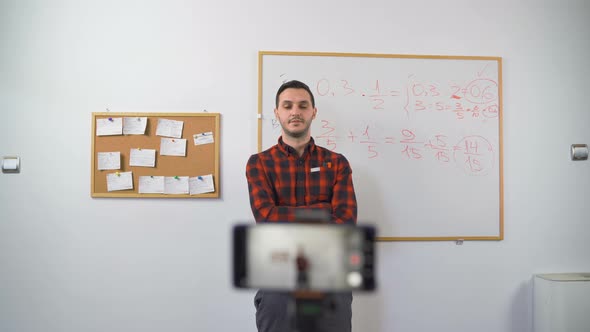 Math Teacher Doing Online Classes Live Streaming and Answering Questions To His Class. Remote alt
