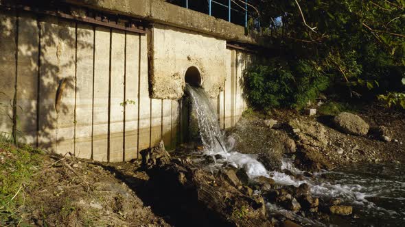 Drainage of sewage from the pipe into the river on the outskirts of the ...