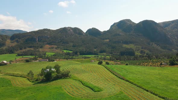 Beautiful aerial shot flying over farmland and fields in Rogaland, Norway alt