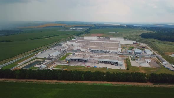Aerial View of Warehouse With Trucks alt