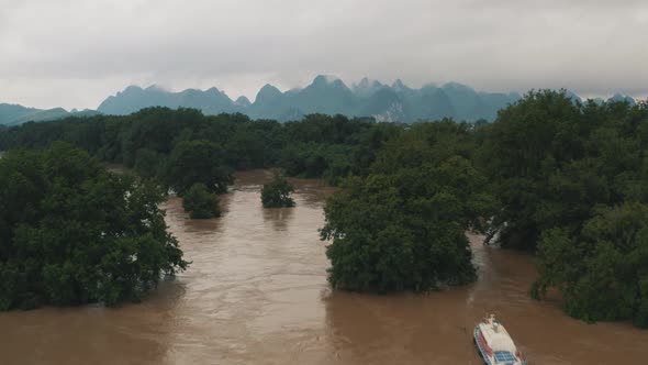 Boats in Flooded River Li Jiang, Guilin, China, Drone Establishing View alt