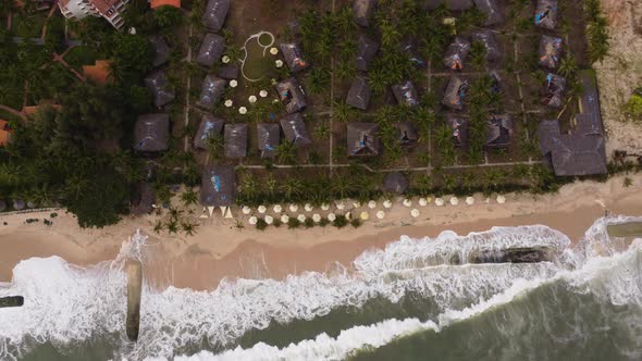 Aerial top down, geotube aqua sand bags preventing climate change sea level rise from destroying coa alt