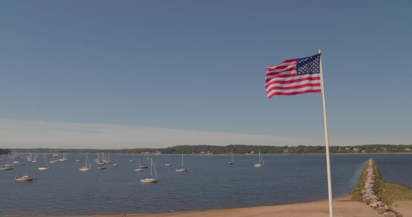 Aerial Pan of Boats Anchored at Harbor and Morgan Memorial Park in Long Island alt