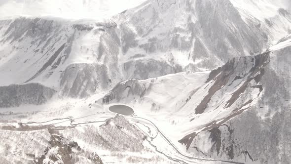 Gudauri, Georgia - April 12, 2021: Aerial view of Russia–Georgia Friendship Monument alt