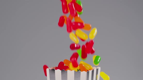 Colorful candy falls in slow motion alt