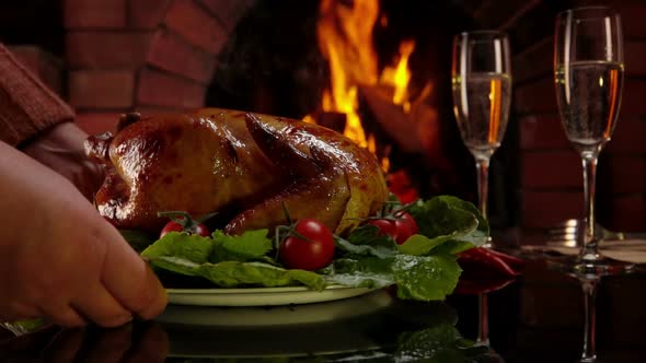 Chicken Is Placed on the Table Against Fireplace alt