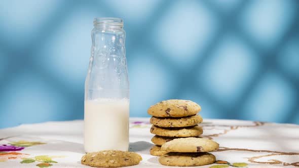 Animation of a pile of cookies being eaten and a bottle of milk emptying out