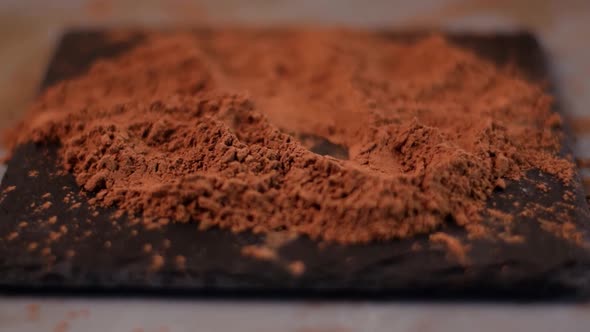 Rolling chocolate truffle in cocoa powder alt