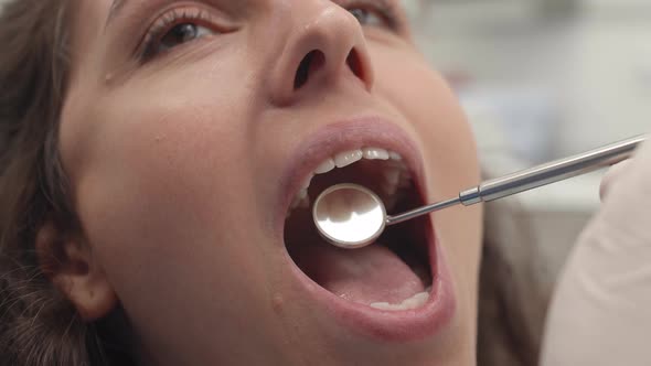 Female Patient Having Checkup in Dental Office alt
