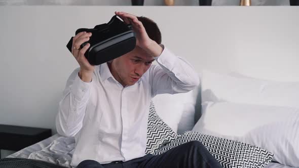 Young Man Remove Virtual Reality Helmet From His Head