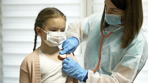 Cute Kid Patient Visiting Female Doctor Pediatrician Nurse Holding Stethoscope Examining Happy