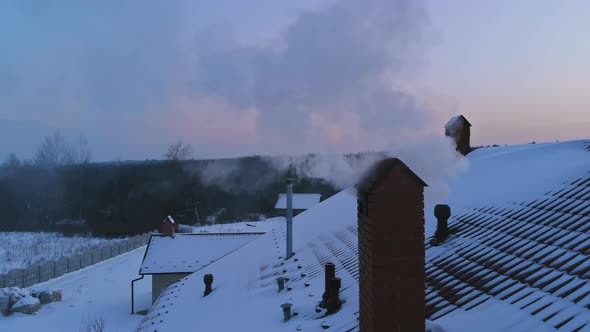 Sunset on Winter Landscape Beautiful Home in the Village the Smoke Comes From the Chimney alt