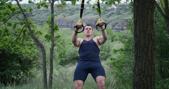 Athletic Man Using Sport Slings alt