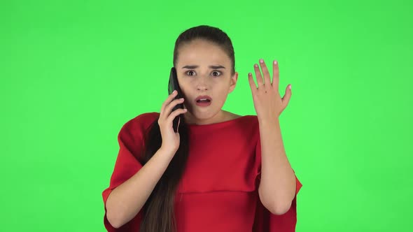 Portrait of Pretty Young Woman Is Upset Speaking on the Phone, Proving Something alt