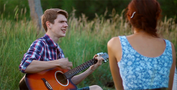 Guy Playing Guitar For His Girlfriend