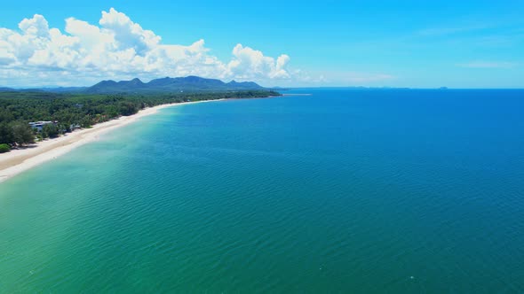 Aerial top view over city and sandy beach. coconut trees. alt