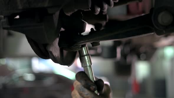 Close Up Unscrewing Car Nuts alt