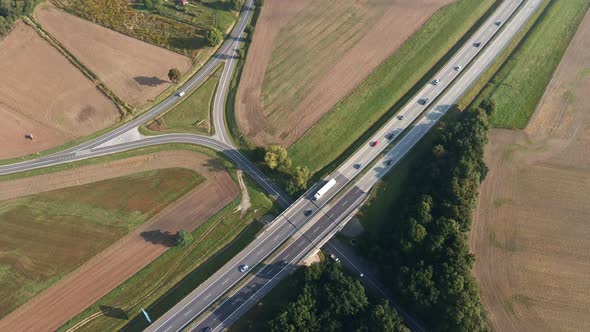 Aerial view of highway with moving cars. Road traffic alt