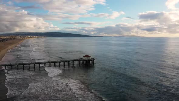 aerial sunset drone view of manhattan beach, California.  cloudy sunset. alt