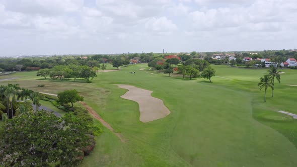 Aerial ascending view of golf course at La Romana in Dominican Republic alt
